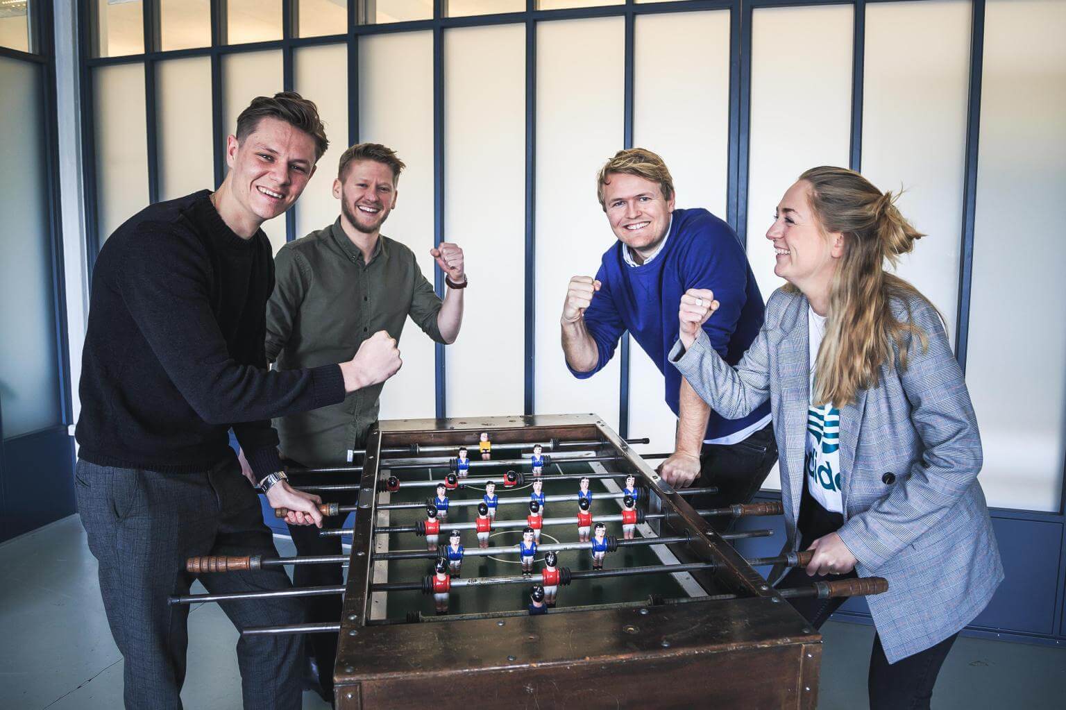 Employees playing table football